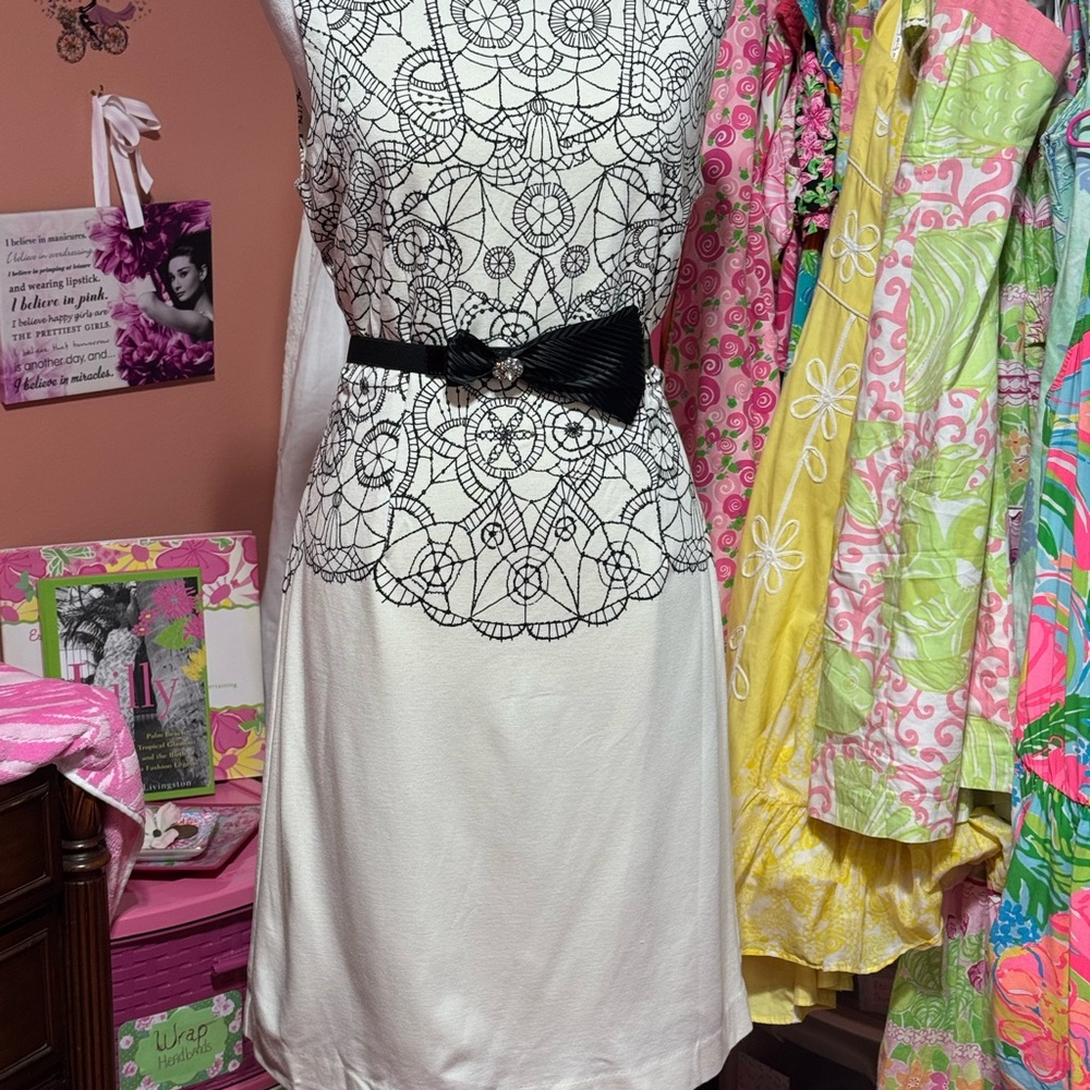 Lilly Pulitzer cream color dress with elegant lace design and black snap belt.